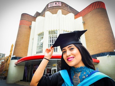 graduate in front of Athena