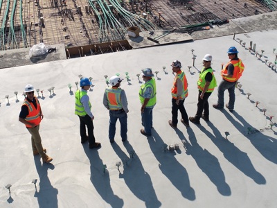 seven construction workers on a site