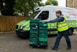 Nick wheels crates of veg from a delivery van