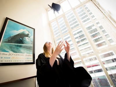 graduate throwing hat in the air