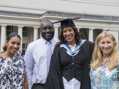 graduate with family